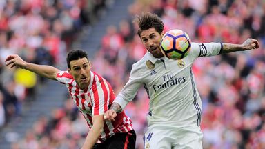 Real Madrid's Sergio Ramos vies with Athletic Bilbao's Aritz Aduriz