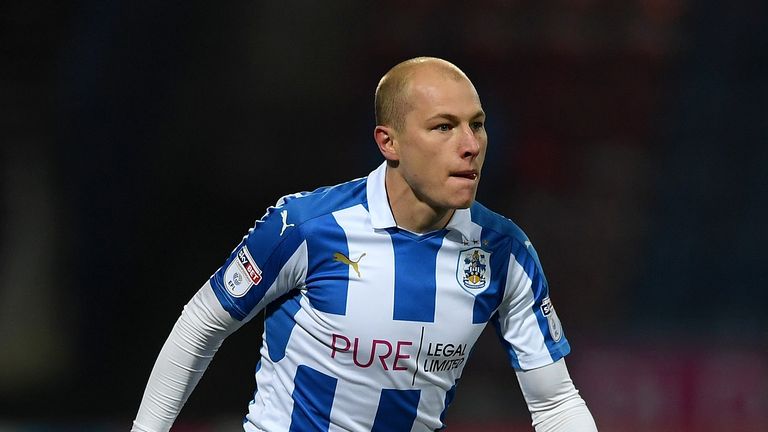 Aaron Mooy converted his spot-kick to pull one back for Huddersfield