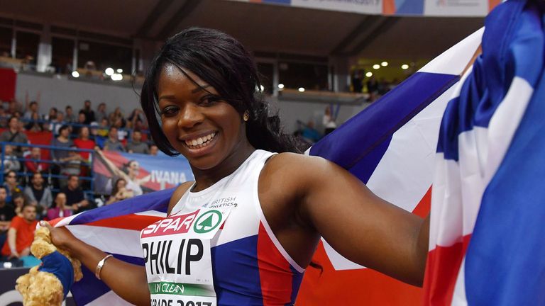 Asha Philip celebrates after winning the women's 60m final 