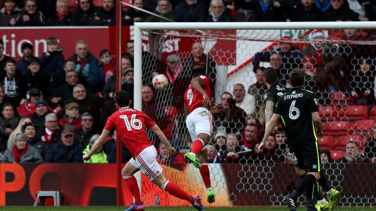 Zach Clough (16) fires Forest ahead