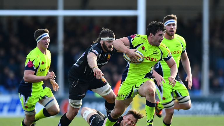 Cameron Neild of Sale Sharks makes a break past Exeter's Jonny Hill 