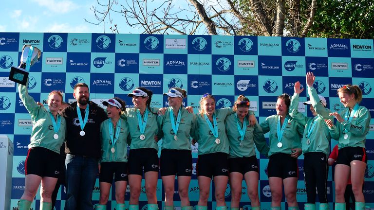 Ashton Brown holds up the trophy after Cambridge enjoyed a record  victory in the women' race