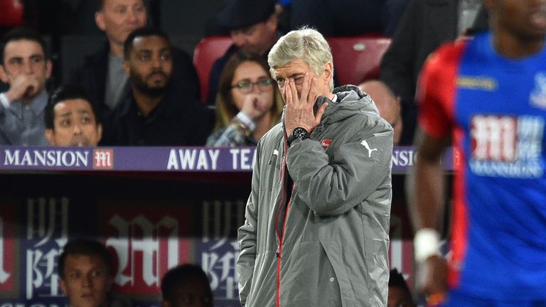 Wenger endured a miserable evening watching Arsenal lose at Selhurst Park