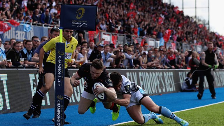 Chris Ashton is denied the opening try by a Lee Jones tackle