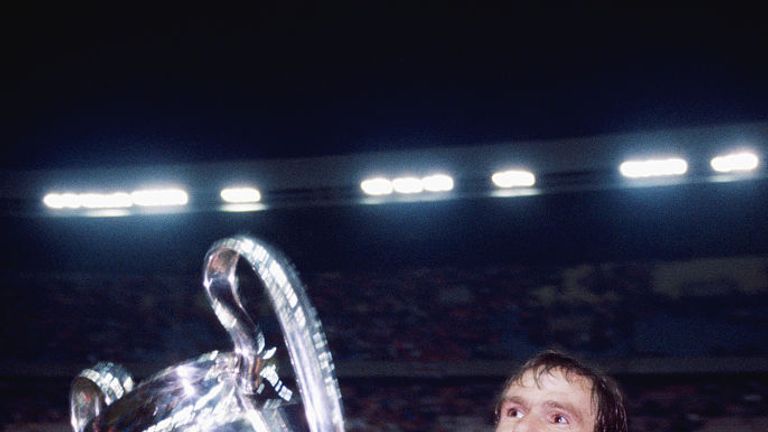 Liverpool captain Phil Thompson parades the trophy after their 1-0 victory over Real Madrid