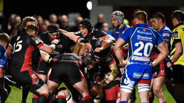 Grant Gilchrist is mobbed after scoring the winning try against the Dragons