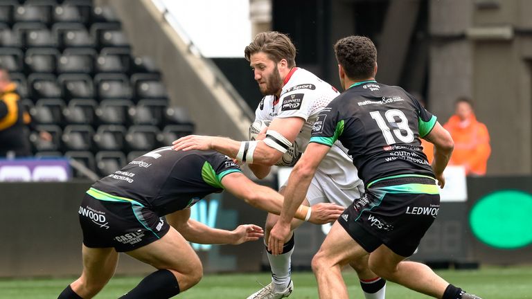Stuart McCloskey is tackled by Ospreys hooker Scott Baldwin