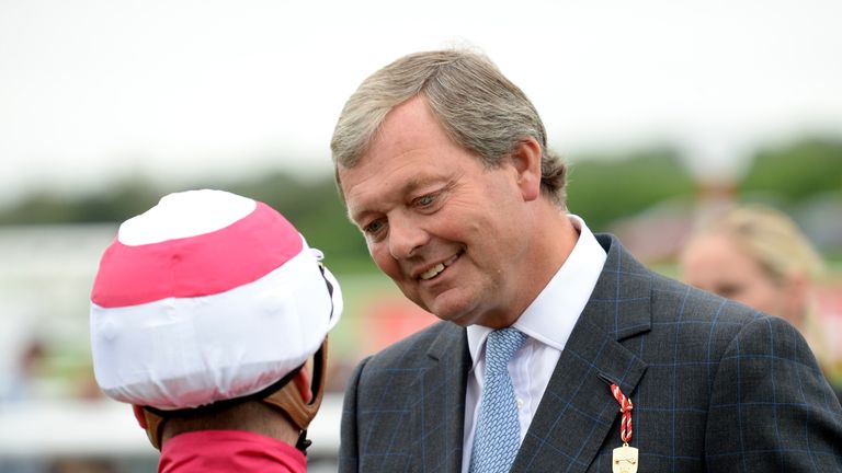 Jockey Andrea Atzeni talks to trainer William Haggas