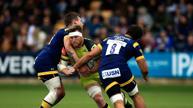 Brendon O'Connor of Leicester is tackled by Ryan Mills (L) and Marco Mama (R) of Worcester 