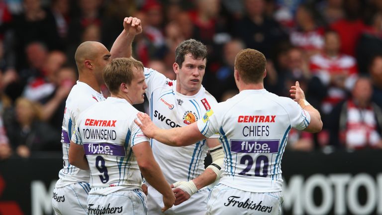 Ian Whitten is congratulated by team-mates after scoring a try