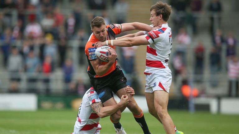 Michael Shenton tackled by Matthew Flemming and Ben Reynolds 