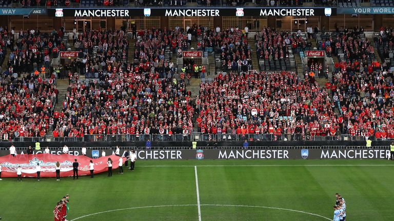 Players observe a minute's silence for the victims of the recent Manchester bombing