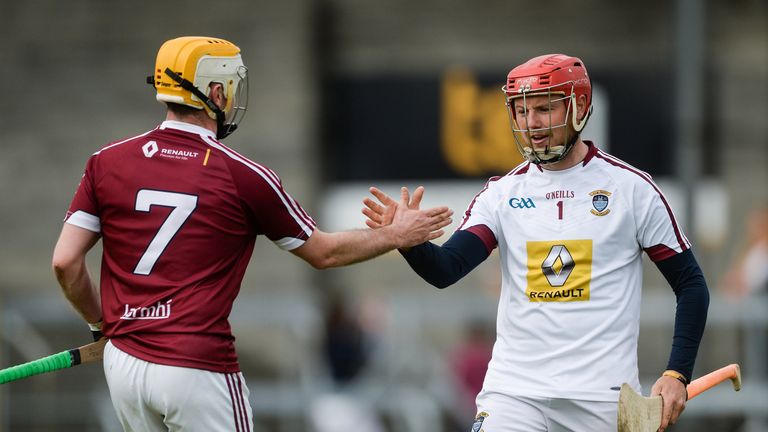 Westmeath's Paddy Maloney (R) and Shane Power (L) celebrate after their historic win over their neighbours in Mullingar