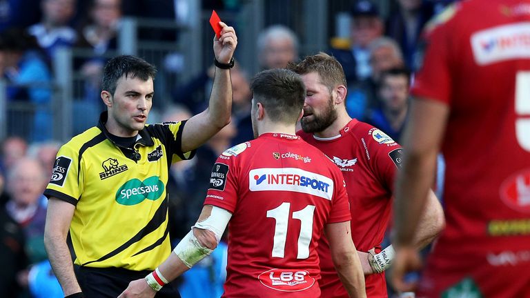 Scarlets' Steff Evans is sent off by referee Marius Mitrea after a tackle on Garry Ringrose of Leinster