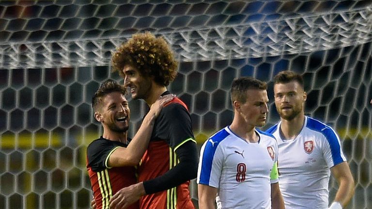 Belgium midfielder Marouane Fellaini (middle) celebrates after scoring during a friendly