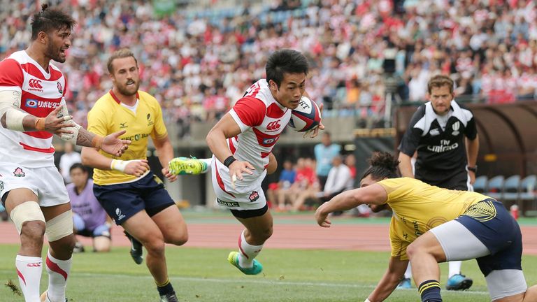 Kenki Fukuoka of Japan leaps to score a try against Romania