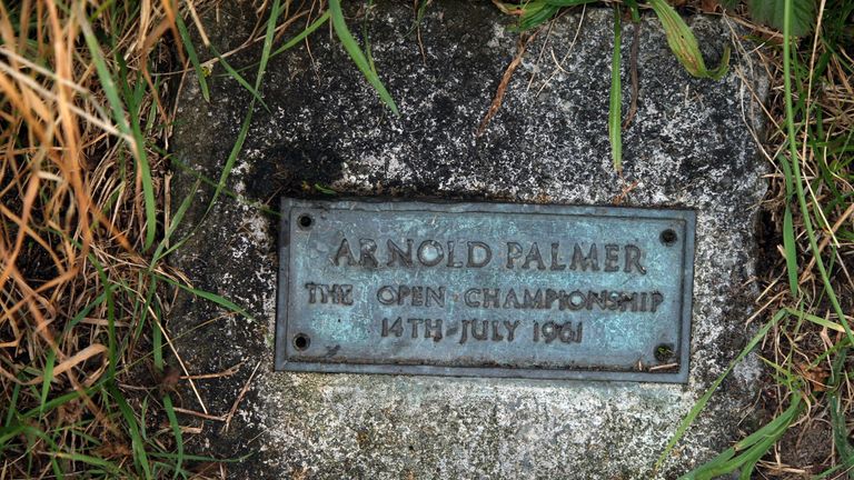 A plaque remembers Palmer's iconic shot at the 16th