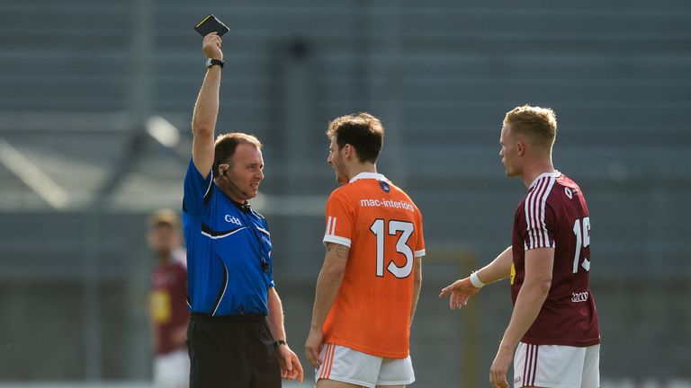 Jamie Clarke of Armagh is shown the black card by referee Padraig O'Sullivan