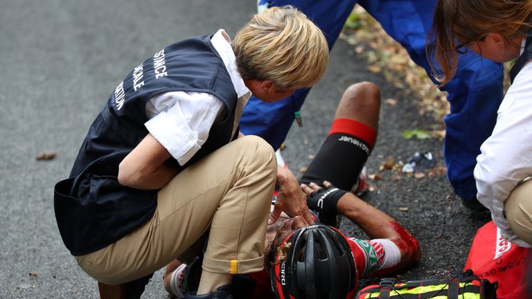 Richie Porte receives treatment after he was injured in a sickening crash