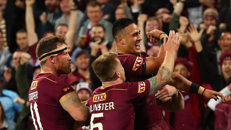 Valentine Holmes is congratulated after completing his hat-trick