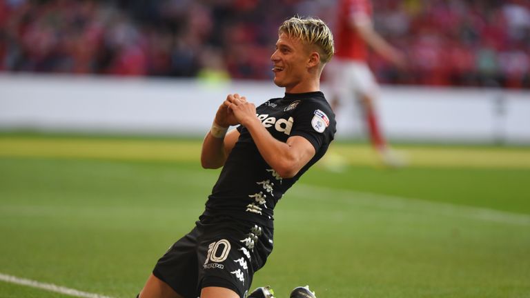 Ezgjan Alioski celebrates scoring for Leeds