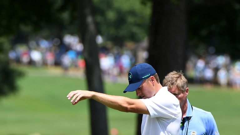 Spieth takes a drop on the seventh hole during his third round