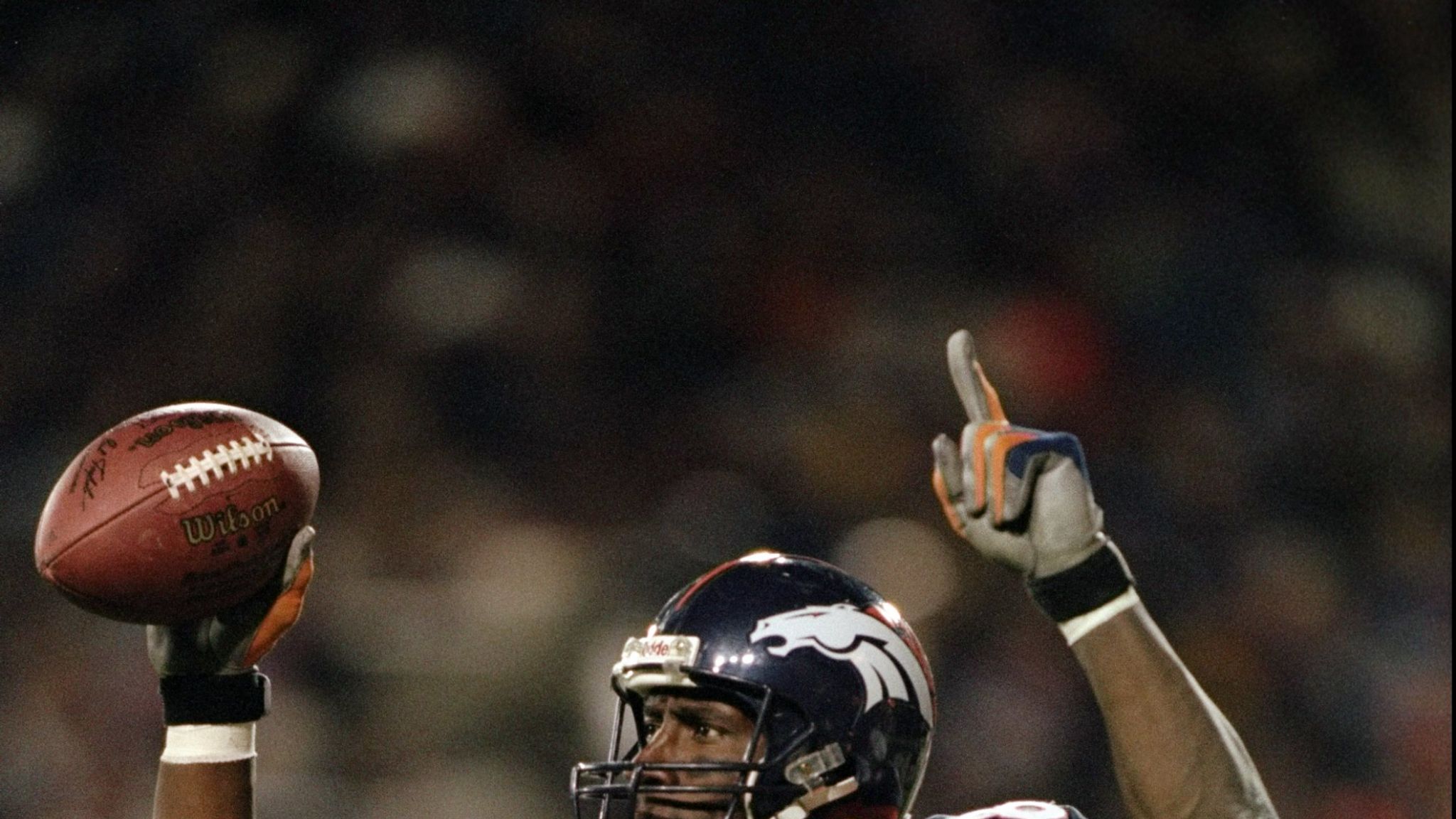 Shannon Sharpe of the Baltimore Ravens looks on from the sidelines