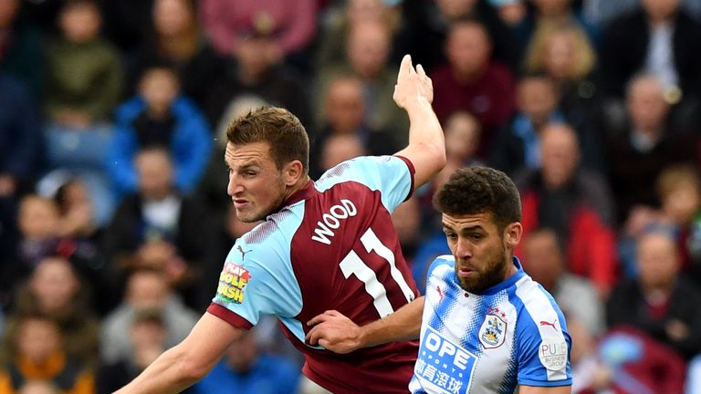 Chris Wood jumps with Tommy Smith in an attempt to win a header during the first half