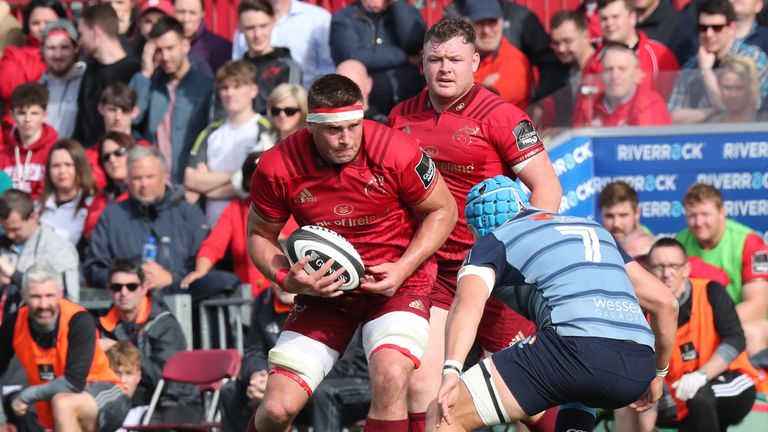 Munster's CJ Stander runs at Olly Robinson