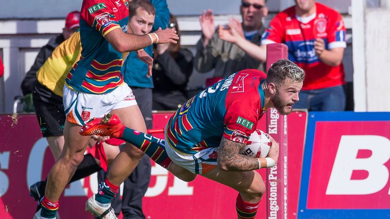 Hull KR's Thomas Minns scores a try against Widnes