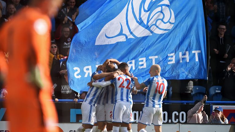 Depoitre is surrounded by team-mates after his 46th-minute goal