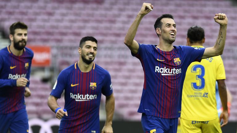 Barcelona midfielder Sergio Busquets (right) celebrates his goal against Las Palmas