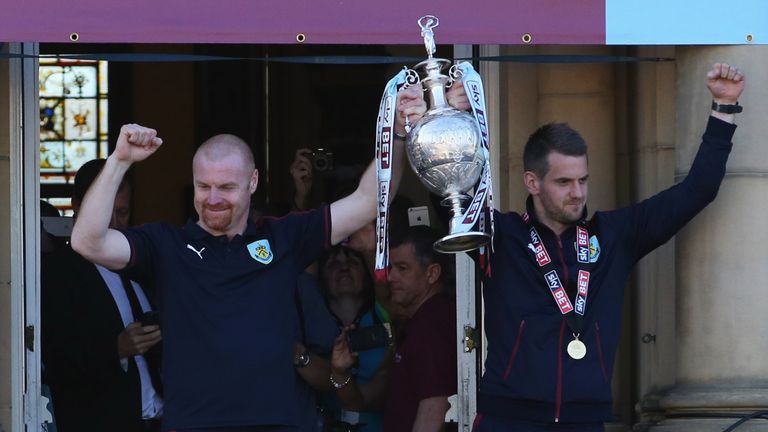 Dyche and Tom Heaton celebrate with the Championship trophy in 2016