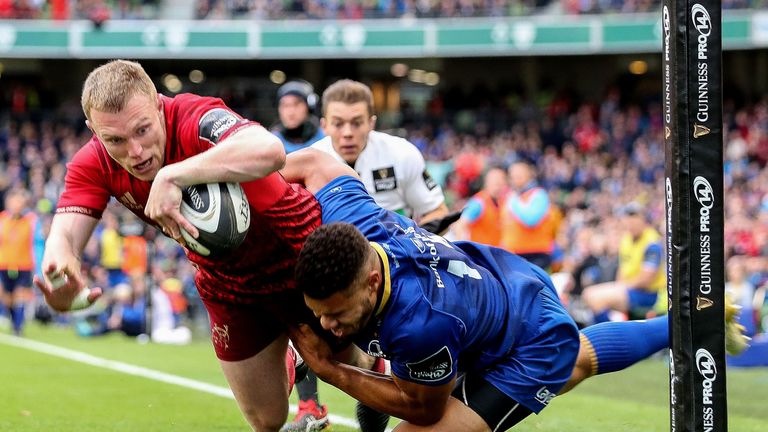 Keith Earls dives in for a try despite the efforts of Adam Byrne 