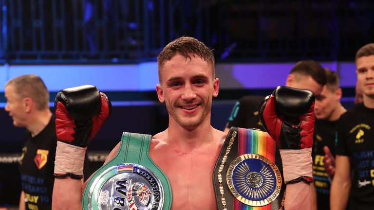 Bellotti poses with the Commonwealth Featherweight Championship