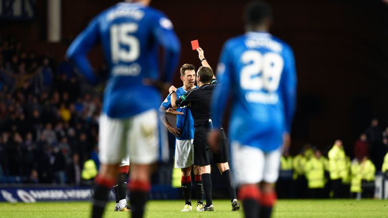 Ryan Jack (centre) is sent off during the dramatic finish at Ibrox