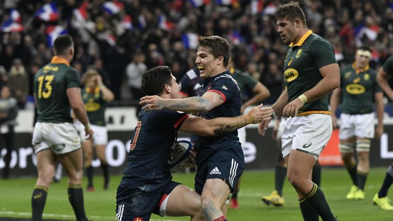 Anthony Belleau celebrates after scoring France's first try 