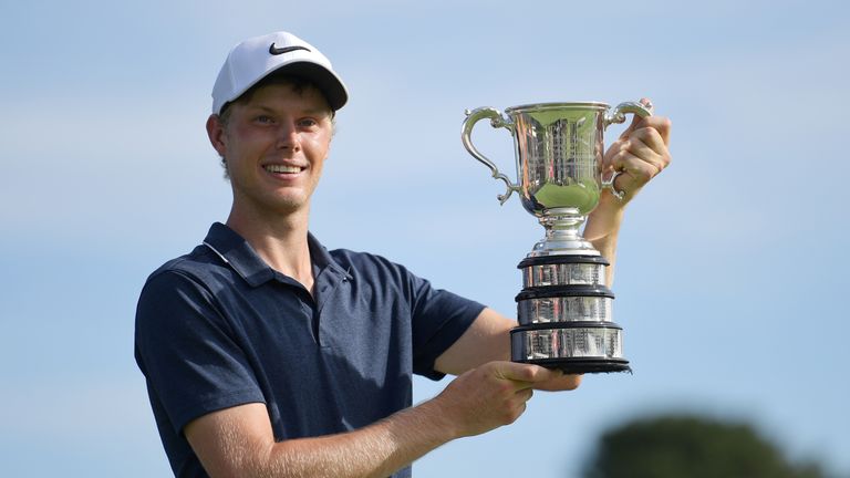 Davis proudly displays the Stonehaven Cup