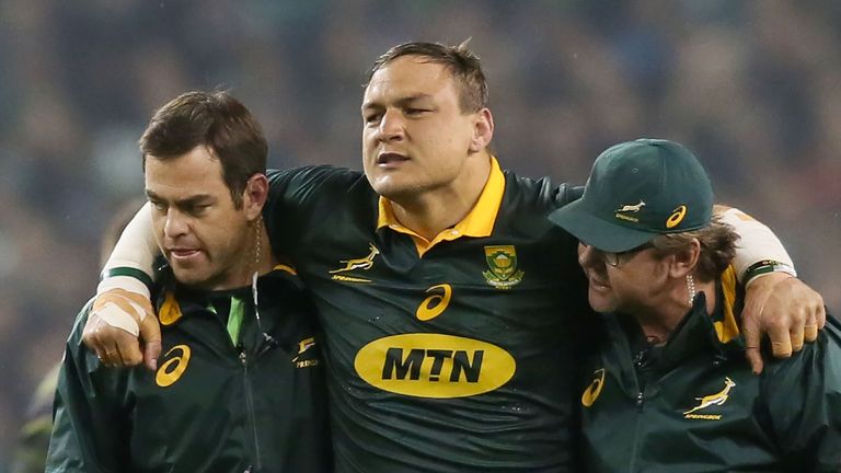 Springbok prop Coenie Oosthuizen leaves the field with an injury