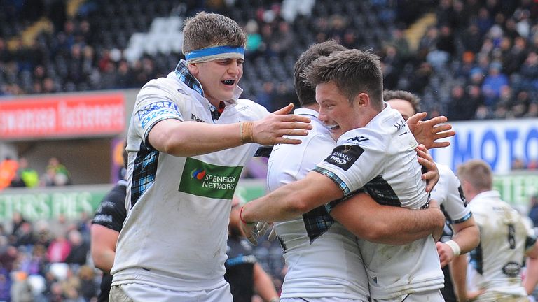 George Horne celebrates scoring the Warriors' fifth try with team-mates