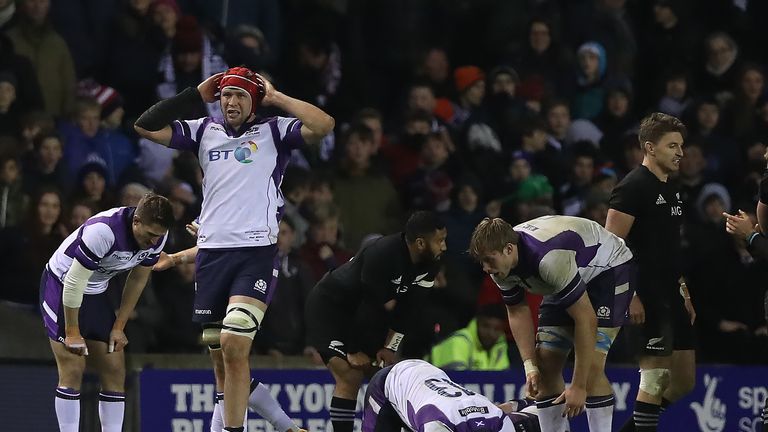 The Scotland players show their disappointment after the final whistle