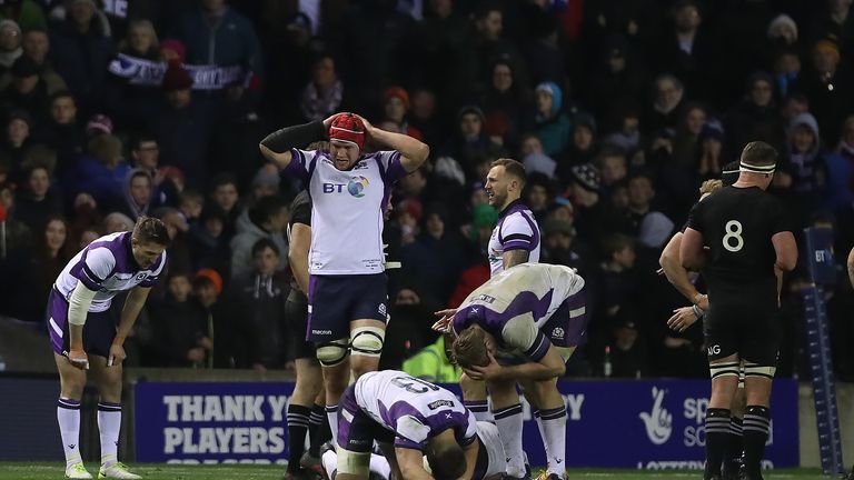 Scotland players react to defeat at full-time at Murrayfield 