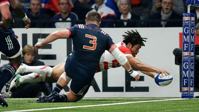 Shota Horie goes over for Japan's first try in the corner after 23 minutes  