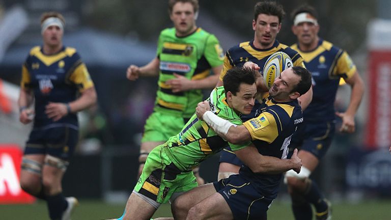 Saints Tom Collins drives Jono Lance backwards with a great hit at Sixways Stadium