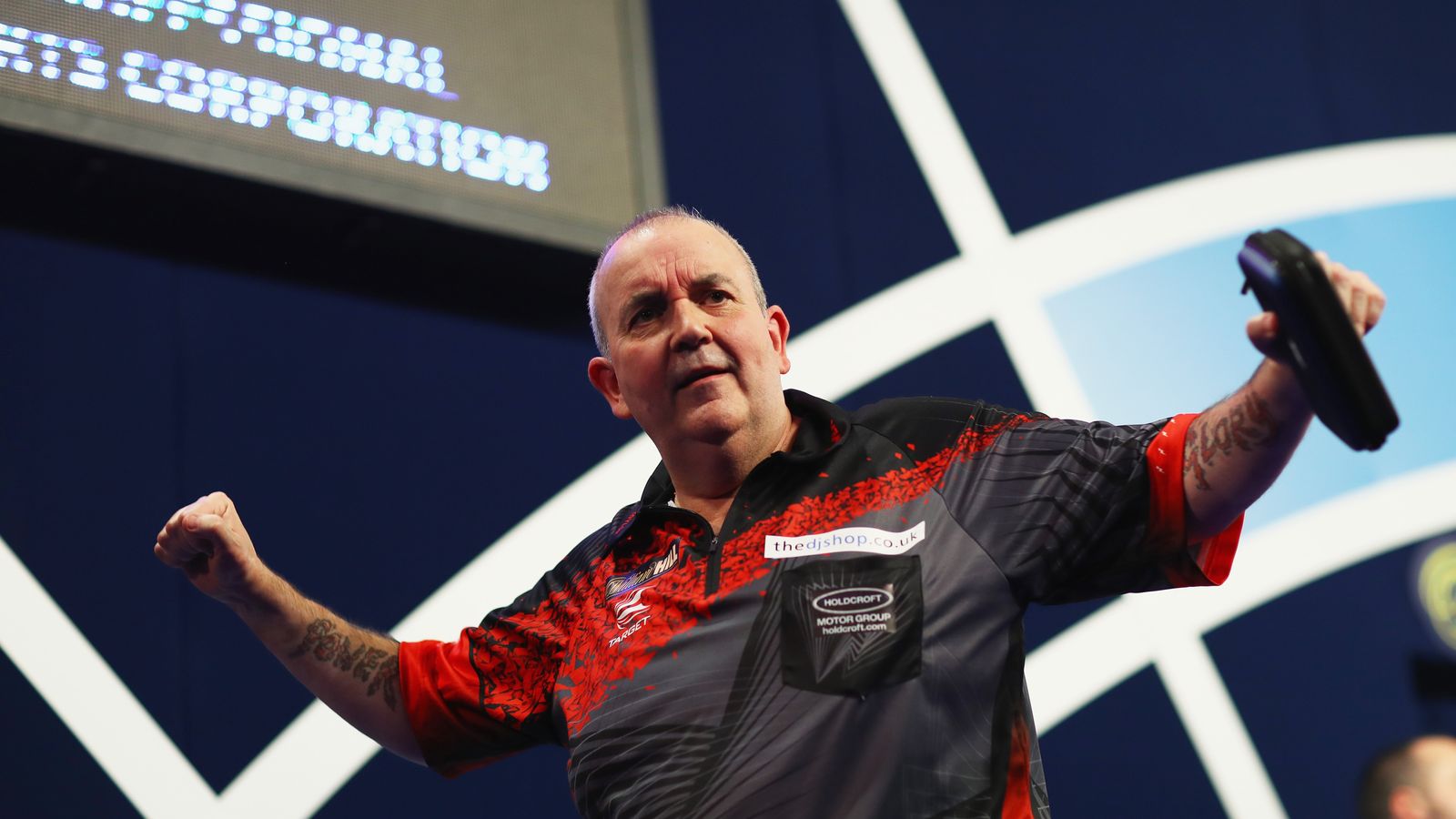 Phil Taylor marches into World Darts Championship last 16 after win