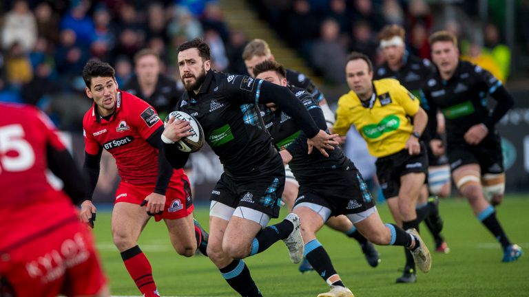 Glasgow's Alex Dunbar makes a break in the second leg of the 1872 Cup match with Edinburgh