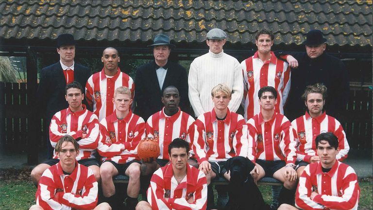 Howe (2nd row, third from R) with old Bournemouth team-mates and his dog