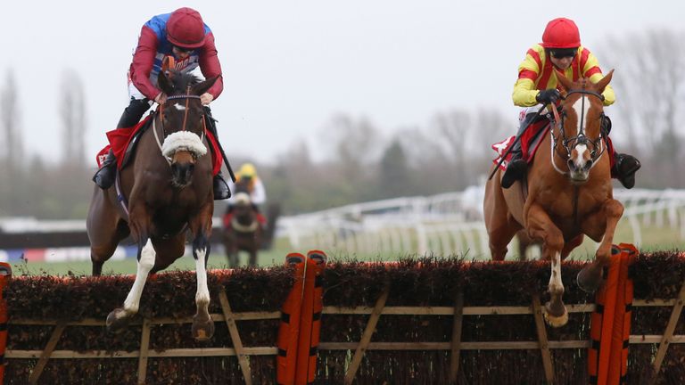 Poetic Rhythm and Paddy Brennan (right) clear the last flight before winning the Chalow Hurdle