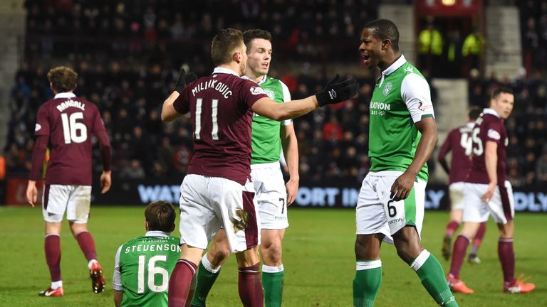 Hibernian's Marvin Bartley (right) squares up to Hearts' David Milinkovic