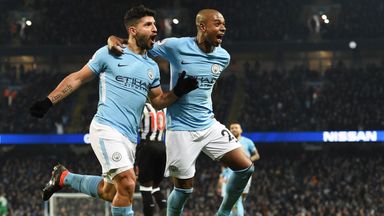 Sergio Aguero celebrates completing his hat-trick with Fernandinho